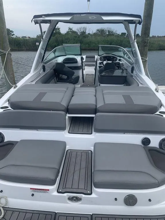 Slide: The Image of 2020 Rinker 29QX BR boat with spacious seating and modern design. - 2