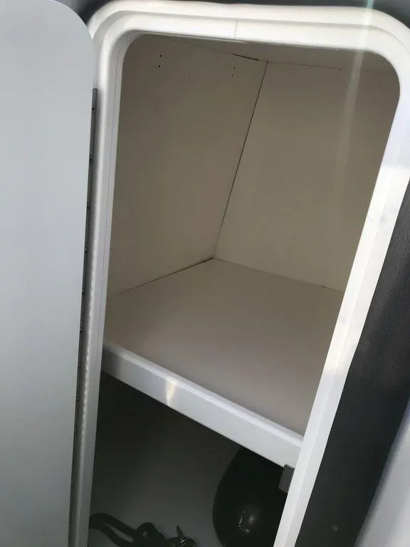 Slide: The Image of Storage compartment in 2020 Rinker 29QX BR boat. - 20