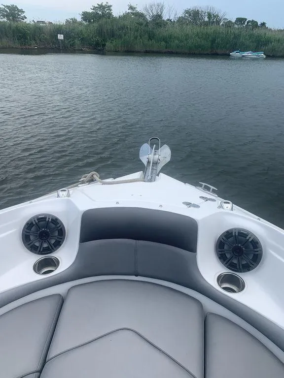Slide: The Image of Bow view of 2020 Rinker 29QX BR boat on calm water. - 22