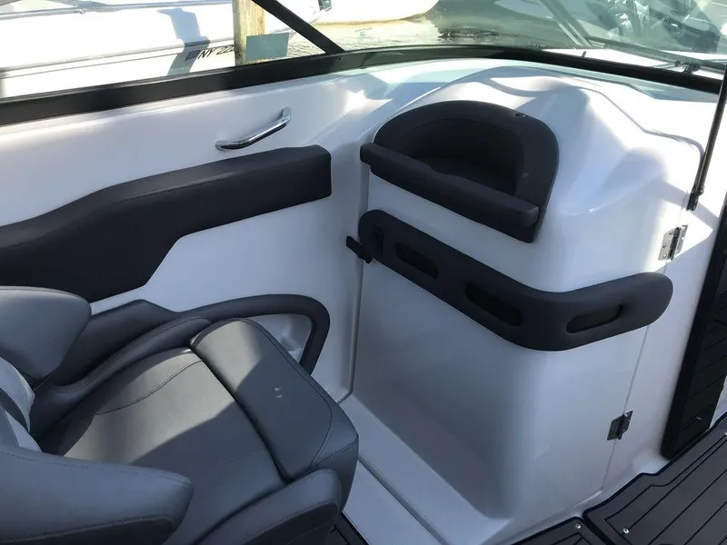 Slide: The Image of 2020 Rinker 29QX BR boat interior with gray seating and sleek design. - 33