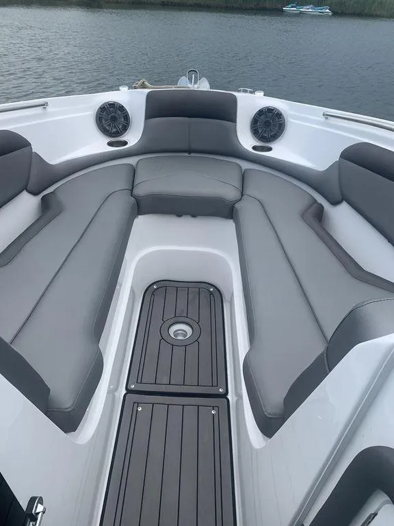 Slide: The Image of 2020 Rinker 29QX BR boat with spacious seating and modern design. - 9