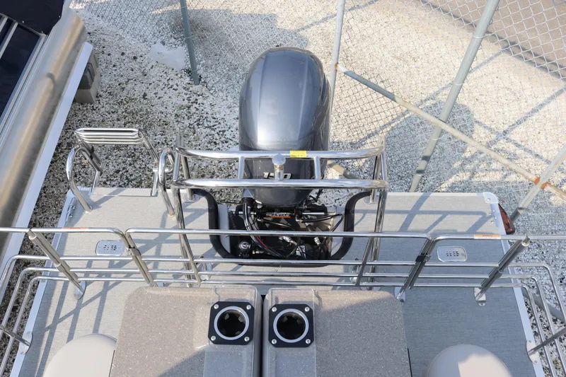 Slide: The Image of 2023 Sylvan L5 DLZ Bar pontoon boat with outboard motor, viewed from above. - 10