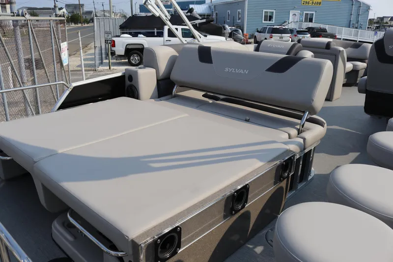Slide: The Image of 2023 Sylvan L5 DLZ Bar pontoon boat with spacious seating and modern design. - 12