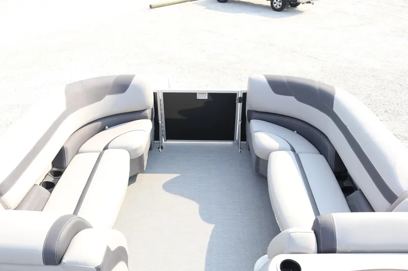 Slide: The Image of 2023 Sylvan L5 DLZ Bar pontoon boat interior with gray seating and open deck layout. - 18