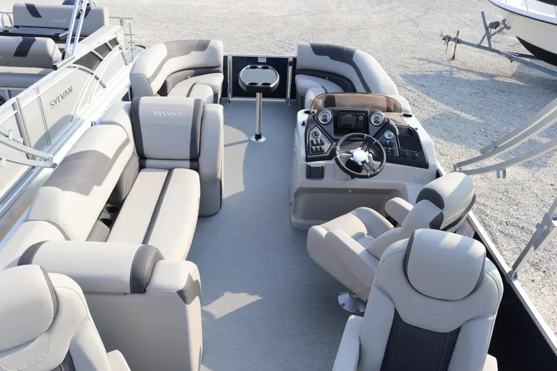 Slide: The Image of 2023 Sylvan L3 Party Fish pontoon boat interior with plush seating and modern helm. - 10
