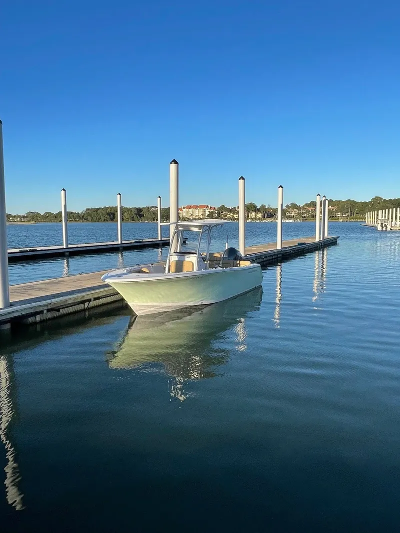 Slide: The Image of 2026 Key West 249 FS boat displayed at a show. - 2