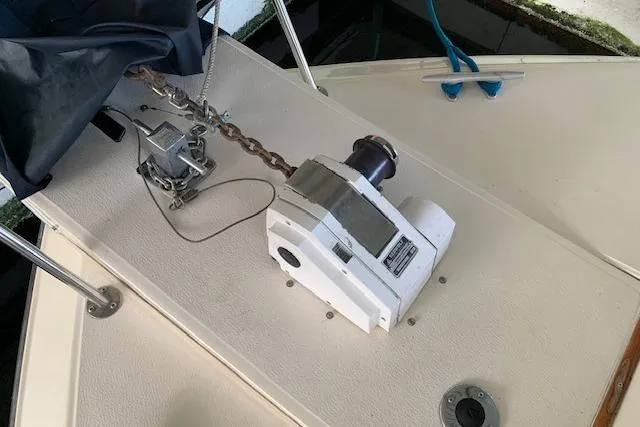 Slide: The Image of 1987 Sea Ray 410 Aft Cabin boat deck with anchor winch and chain. - 7
