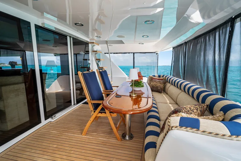 Slide: The Image of Luxurious 2002 NorthCoast Pilothouse Motoryacht interior with elegant seating and ocean view. - 18