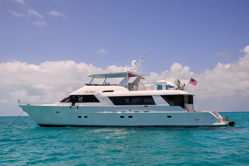 Slide: The Image of 2002 NorthCoast Pilothouse Motoryacht on turquoise water under a clear sky. - 6