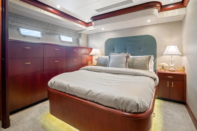 Slide: The Image of Luxurious bedroom in 2002 NorthCoast Pilothouse Motoryacht with elegant wood cabinetry and ambient lighting. - 41