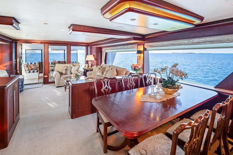 Slide: The Image of Luxurious interior of 2002 NorthCoast Pilothouse Motoryacht with elegant dining and seating area. - 21