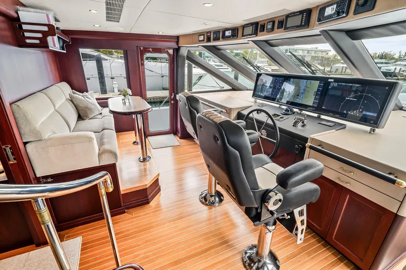 Slide: The Image of Luxurious 2002 NorthCoast Pilothouse Motoryacht interior with modern helm and comfortable seating. - 16