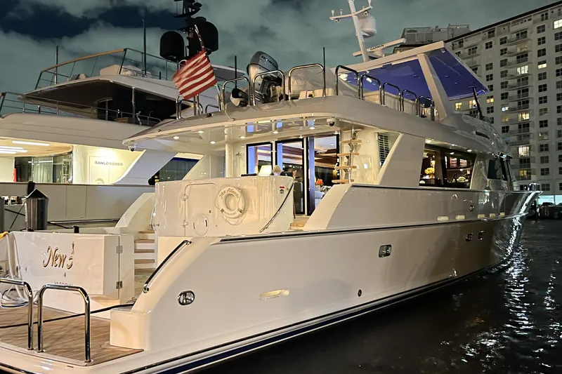 Slide: The Image of Luxurious 2002 NorthCoast Pilothouse Motoryacht docked at night, showcasing elegant design. - 49