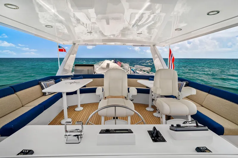 Slide: The Image of Luxurious 2002 NorthCoast Pilothouse Motoryacht interior with ocean view and elegant seating. - 11