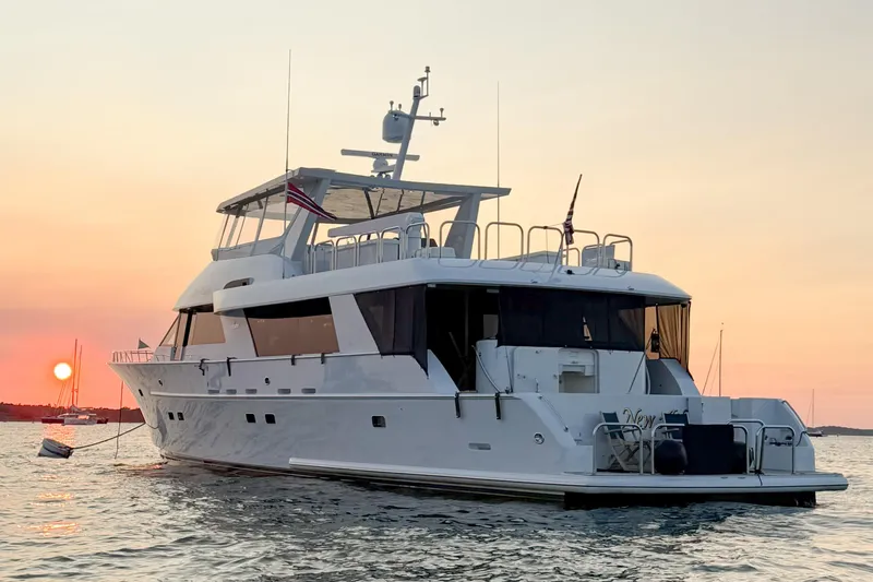 Slide: The Image of 2002 NorthCoast Pilothouse Motoryacht at sunset, anchored on calm waters. - 7