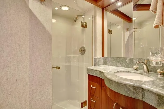 Slide: The Image of Luxurious bathroom with marble sink and glass shower on a yacht. - 36