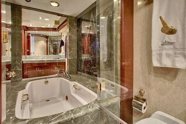 Slide: The Image of Luxurious bathroom with a whirlpool tub, marble accents, and elegant fixtures. - 35