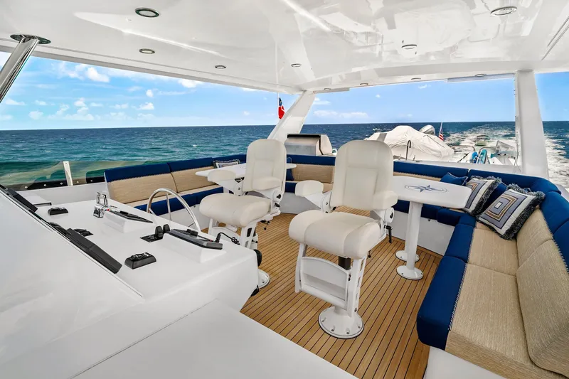 Slide: The Image of Luxurious 2002 NorthCoast Pilothouse Motoryacht interior with ocean view and plush seating. - 8