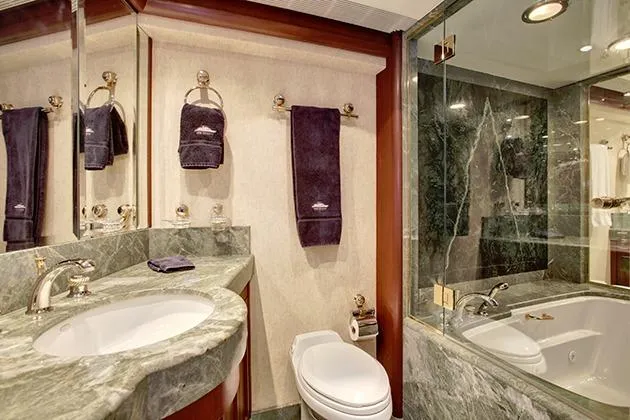 Slide: The Image of Luxurious bathroom with marble sink, toilet, and large shower in a yacht. - 34