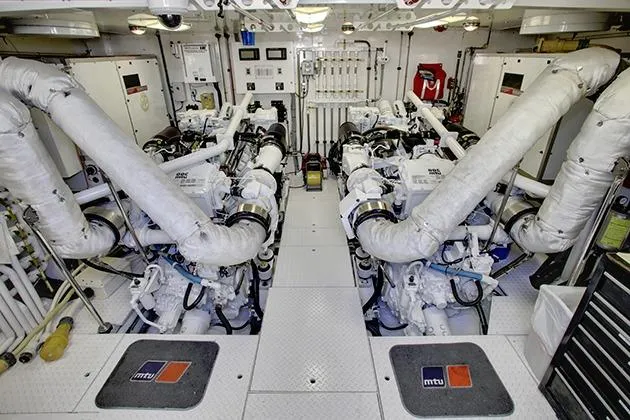Slide: The Image of Engine room of a 2002 Northcoast Yacht with two large engines and technical equipment. - 47