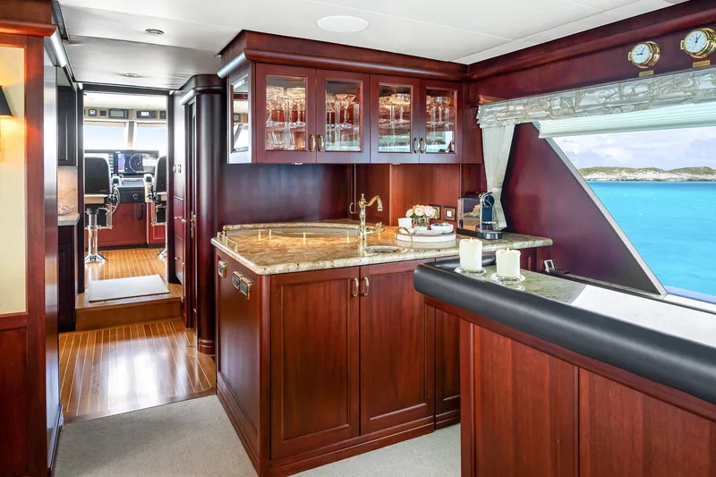 Slide: The Image of Luxurious 2002 NorthCoast Pilothouse Motoryacht interior with elegant wood cabinetry and ocean view. - 24