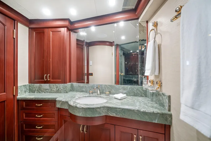 Slide: The Image of Luxurious bathroom in 2002 NorthCoast Pilothouse Motoryacht with marble countertop and wooden cabinetry. - 39
