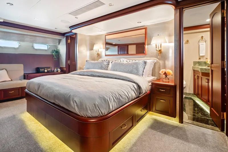 Slide: The Image of Luxurious bedroom in 2002 NorthCoast Pilothouse Motoryacht with elegant wood finishes and ambient lighting. - 43