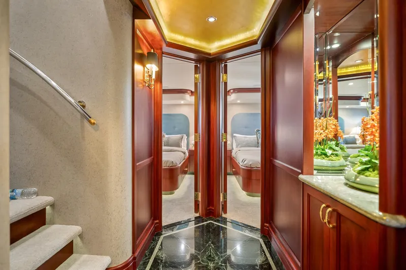 Slide: The Image of Luxurious interior of 2002 NorthCoast Pilothouse Motoryacht with elegant wood finishes and plush bedding. - 31