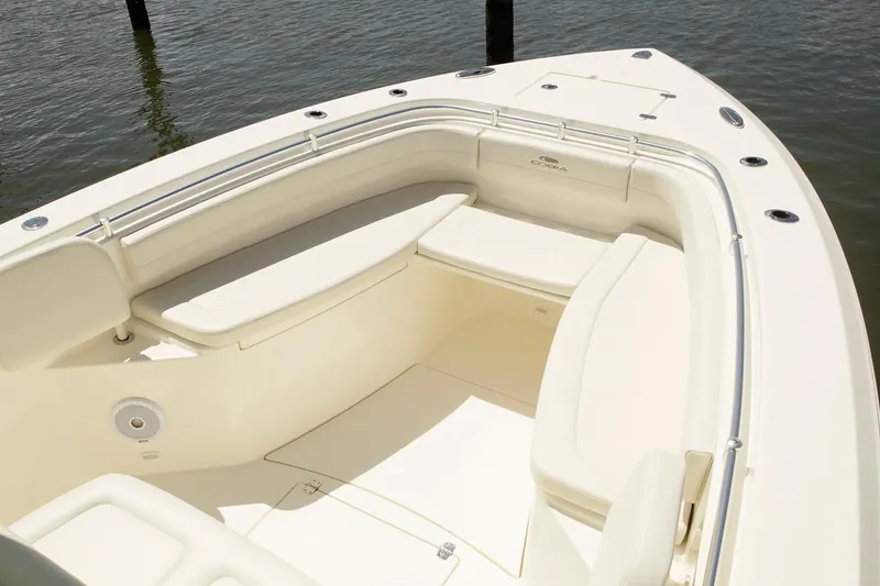 Slide: The Image of 2024 Cobia 301 CC boat with spacious seating area. - 3
