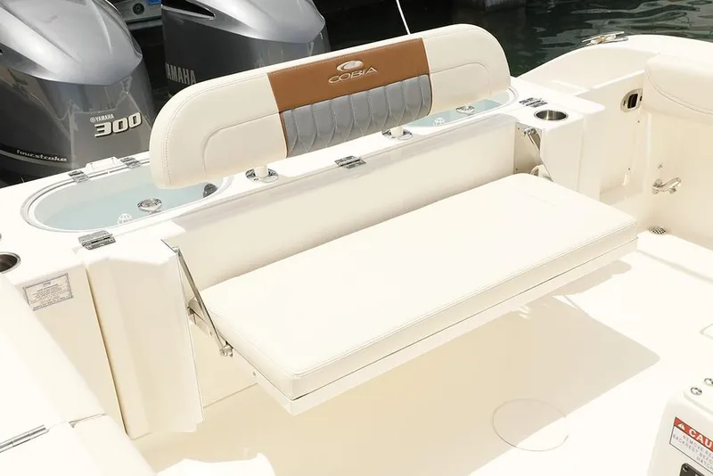 Slide: The Image of 2024 Cobia 301 CC boat with fold-down seating and Yamaha 300 engines. - 4