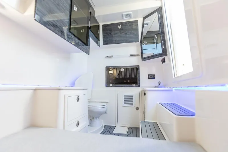 Slide: The Image of 2024 Cobia 350 CC boat interior with modern amenities and sleek design. - 8