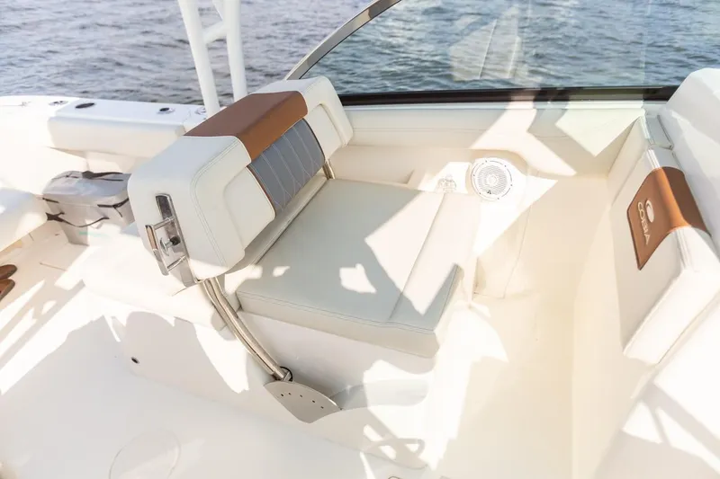 Slide: The Image of 2024 Cobia 240 Dual Console boat interior seating with ocean view. - 13