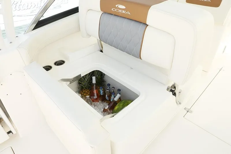 Slide: The Image of 2024 Cobia 280 Dual Console boat with built-in cooler and beverages. - 11