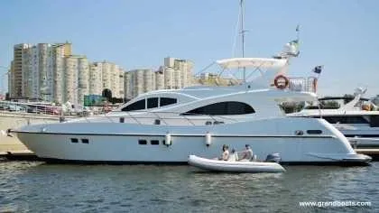 Slide: The Image of 2024 Grand Inflatables S420 yacht docked with inflatable boat in water. - 9