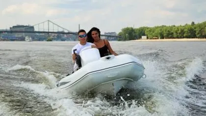 Slide: The Image of 2024 Grand Inflatables S330 boat on water with two people. - 3