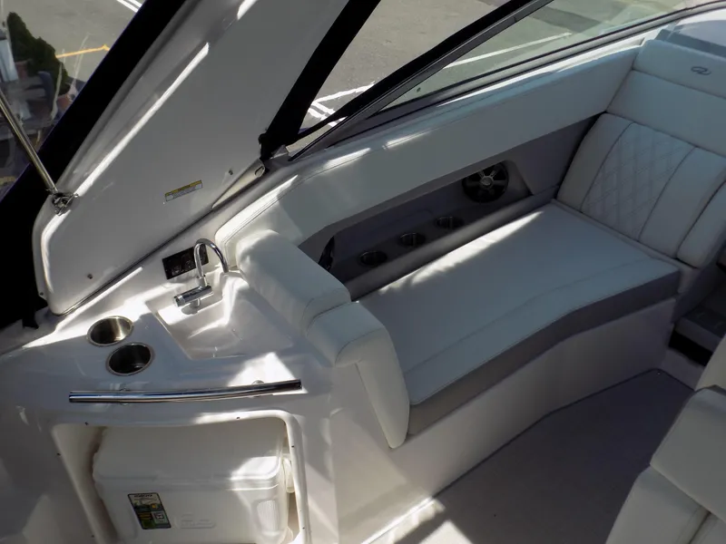Slide: The Image of 2022 Regal 28 Express boat interior with seating and sink area. - 4