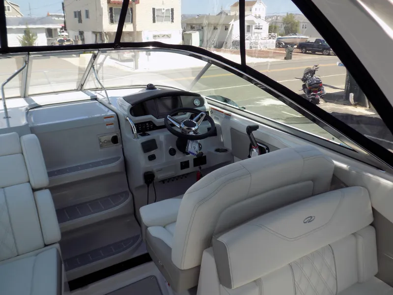 Slide: The Image of 2022 Regal 28 Express boat interior with modern helm and seating. - 5