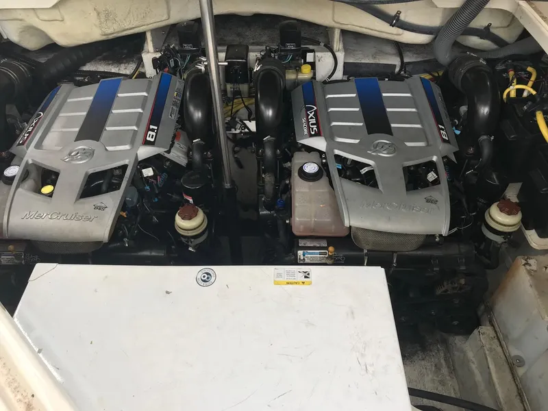Slide: The Image of Twin MerCruiser engines in a 2009 Maxum 3100 SE boat. - 42