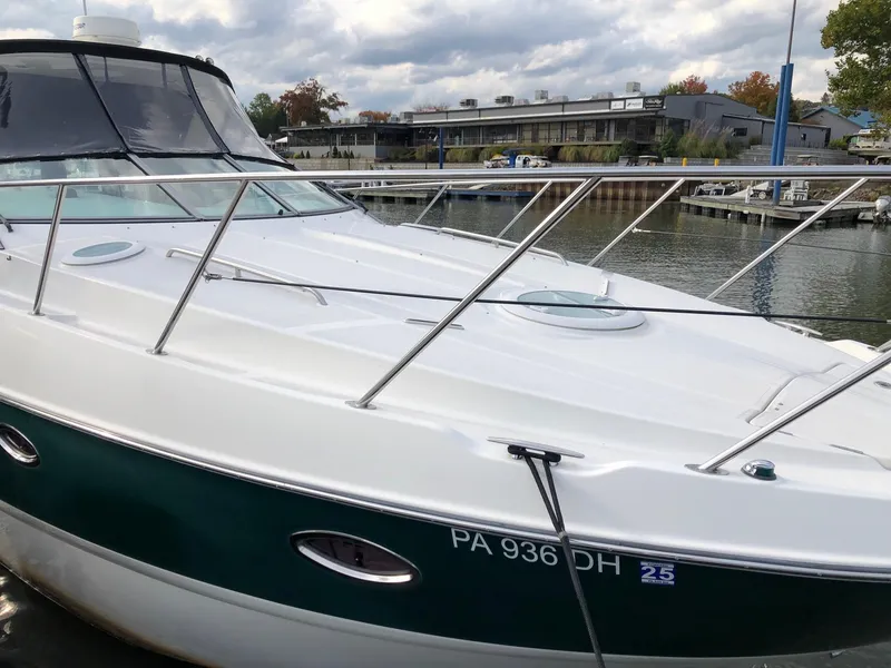 Slide: The Image of 2009 Maxum 3100 SE boat docked at marina with overcast sky. - 5