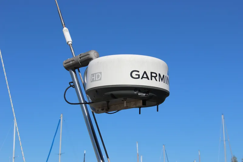 Slide: The Image of Garmin radar on a 1988 Cape George 38 sailboat against a clear blue sky. - 14