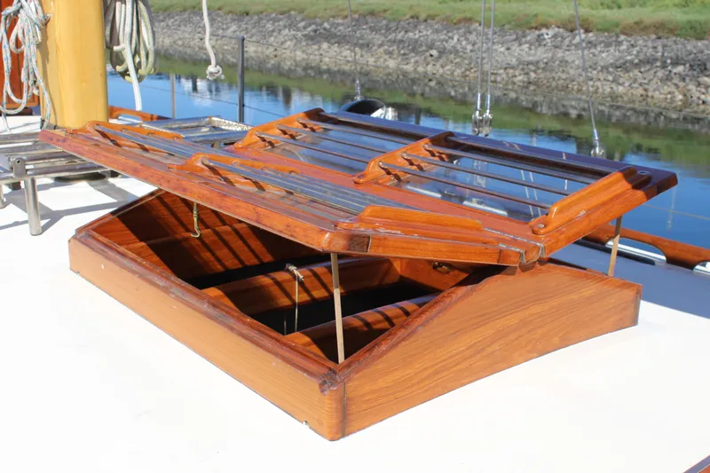 Slide: The Image of Wooden hatch on 1988 Cape George 38 sailboat, open with glass panels, dockside view. - 16