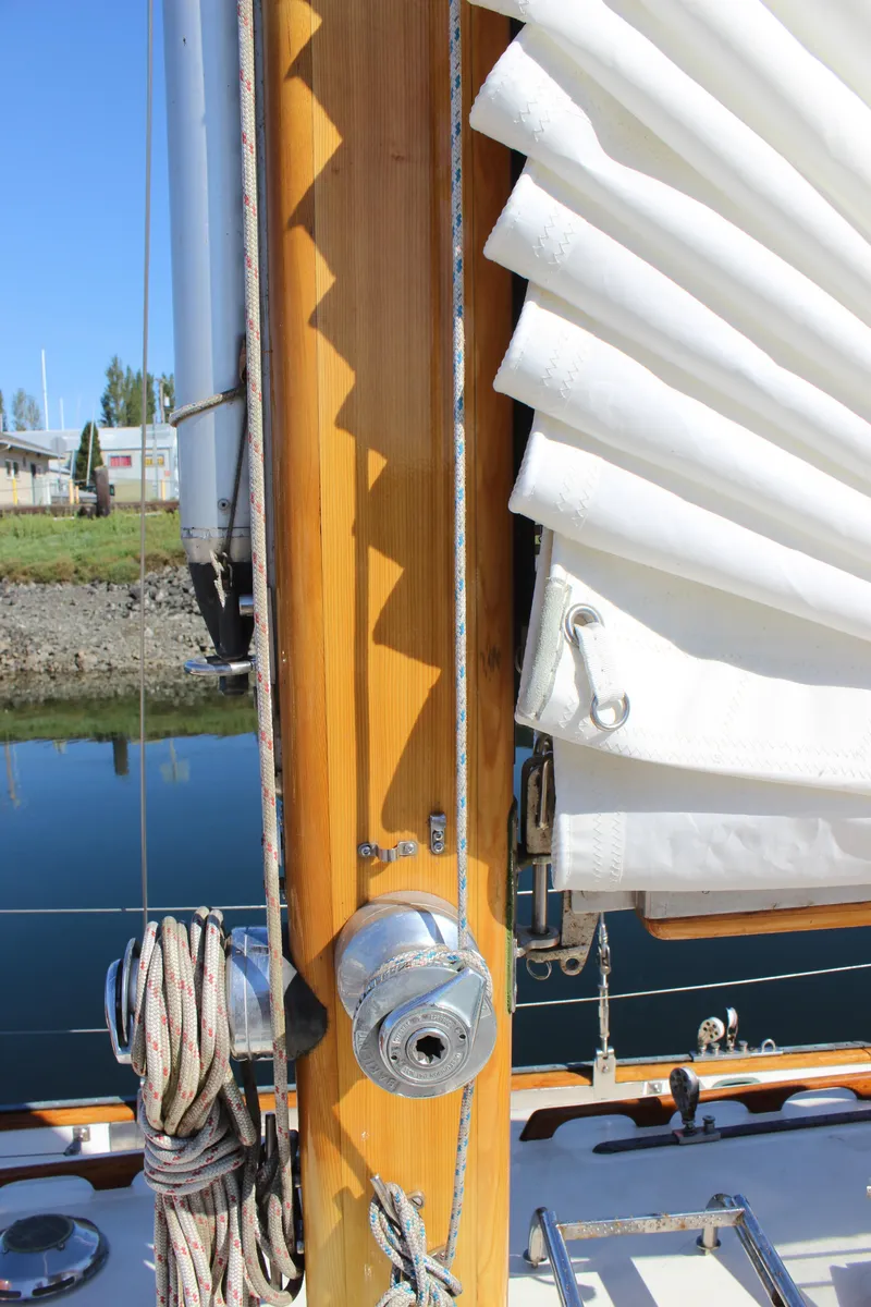 Slide: The Image of Cape George 38 sailboat mast and rigging detail, 1988 model, with neatly folded sail. - 18