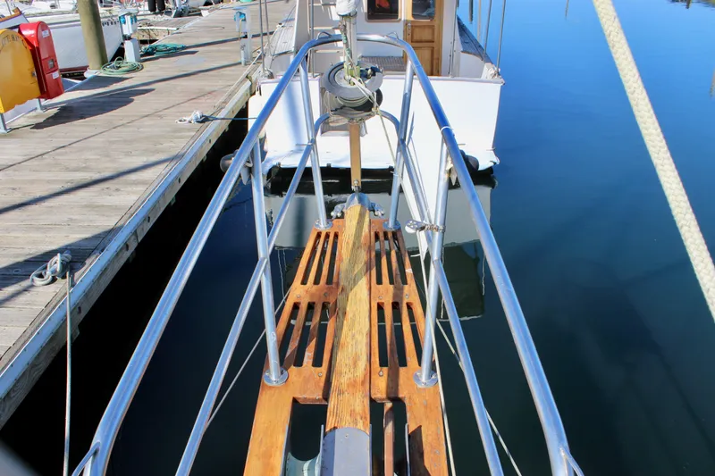 Slide: The Image of Cape George 38 sailboat bow with wooden deck, docked at marina, 1988 model. - 22
