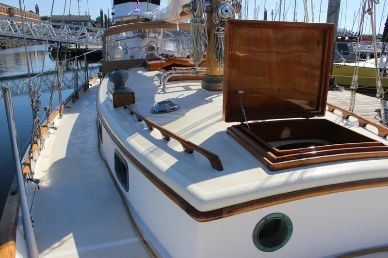 Slide: The Image of Cape George 38 sailboat, 1988 model, docked with open hatch and wooden deck details. - 26