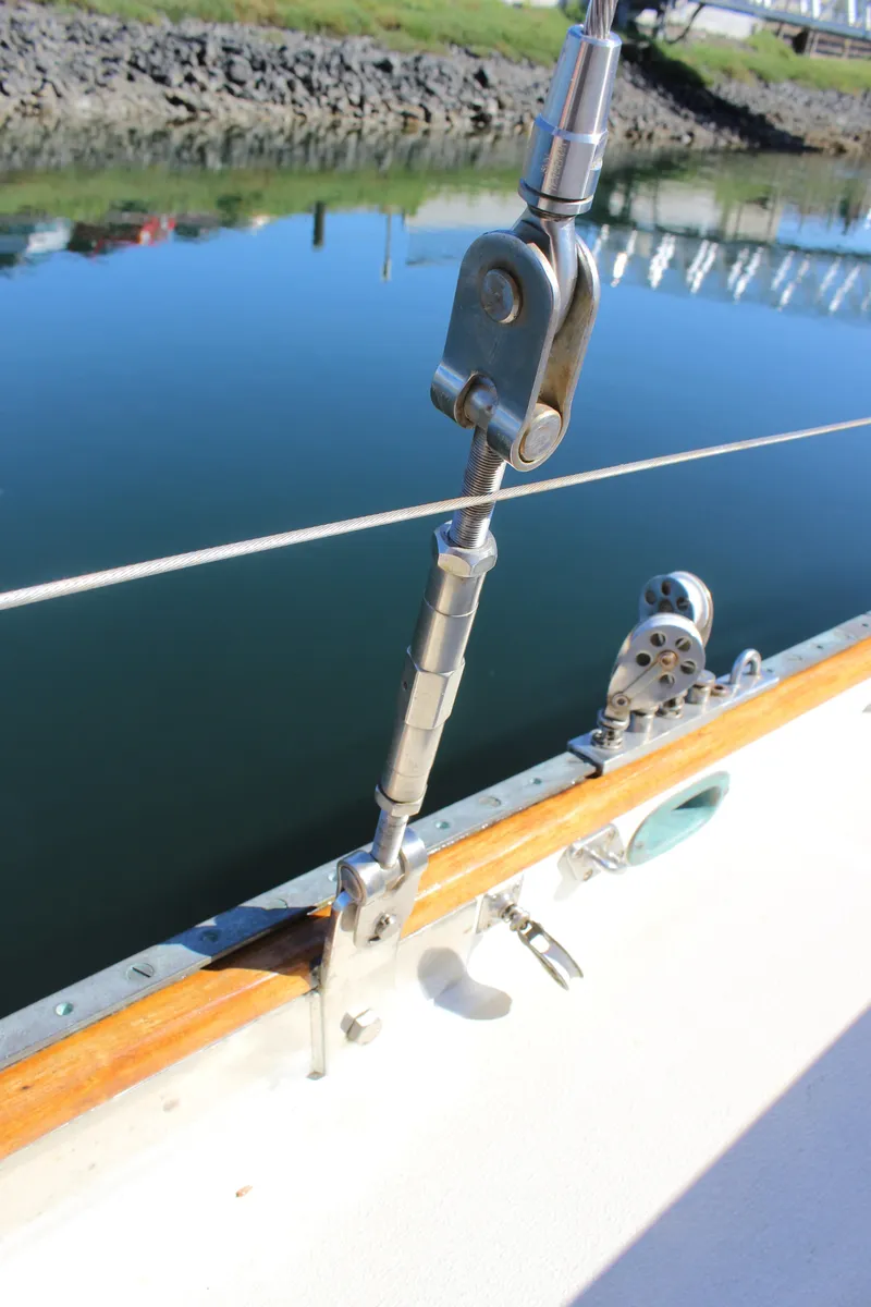 Slide: The Image of Close-up of 1988 Cape George 38 sailboat rigging and deck details by the water. - 29