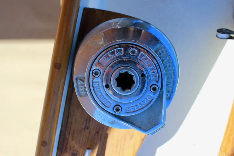 Slide: The Image of Winch mechanism on 1988 Cape George 38 sailboat, featuring polished metal and wooden accents. - 33