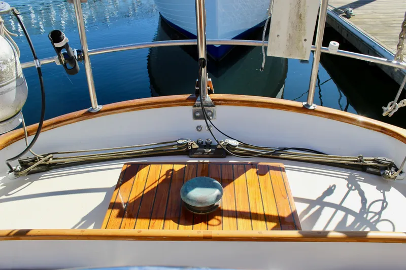 Slide: The Image of Cockpit of 1988 Cape George 38 sailboat with wooden deck and nautical equipment. - 43