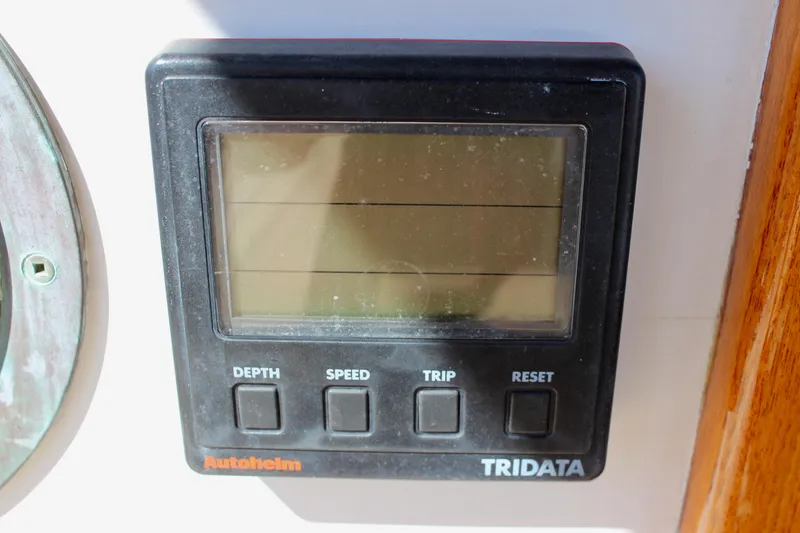 Slide: The Image of Autohlem Tridata display on 1988 Cape George 38 sailboat, showing depth, speed, and trip functions. - 45