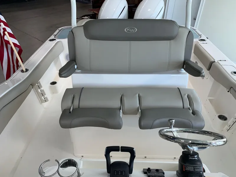 Slide: The Image of 2024 Key West 263 FS boat interior with dual seats and steering wheel. - 16