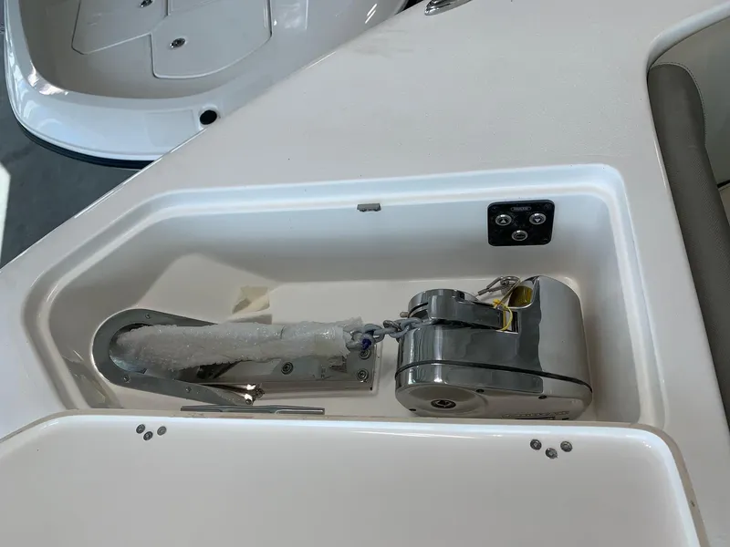 Slide: The Image of 2024 Key West 263 FS boat anchor compartment with stainless steel anchor and winch. - 20
